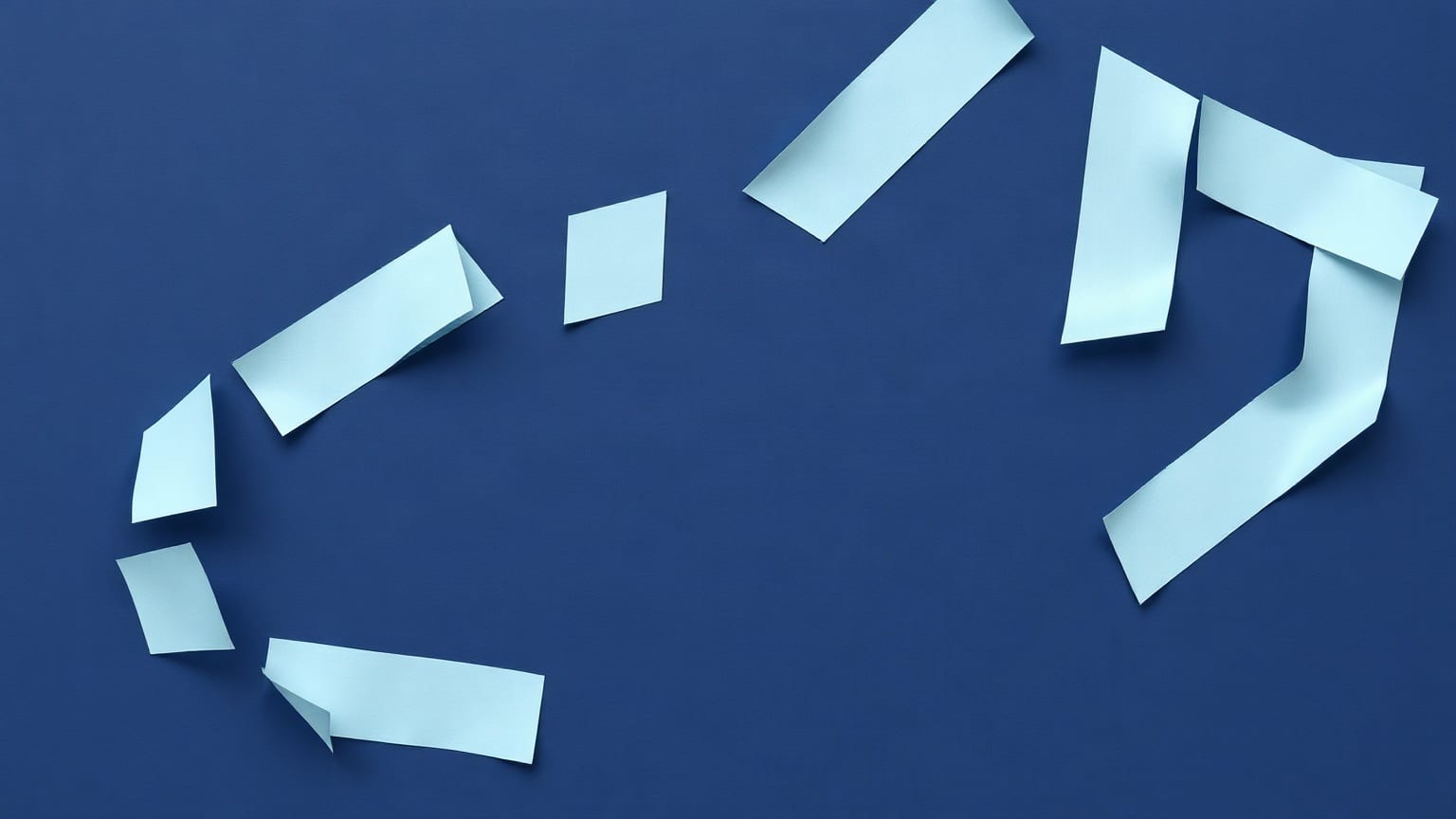 A pale blue paper decagon on a deep navy ground, its outline broken into ten straight segments with narrow gaps between them